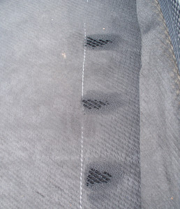 Burning holes through the geotextile layers is a quick way to prepare for geonet joining, but is it a safe and approved method? (CLICK IMAGE for larger view.)